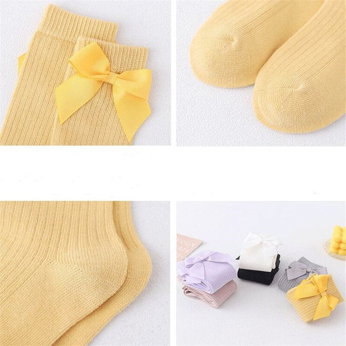 Seasonal Elegance: Delicate Bow Adorned Knee High Socks for Girls